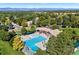 Aerial view of community pool, trees, and clubhouse at 5344 E Otero Dr, Centennial, CO 80122