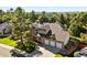Beautiful brick home with a three-car garage and mature trees in a well-maintained neighborhood at 5344 E Otero Dr, Centennial, CO 80122