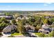 Aerial view of a lovely neighborhood with beautiful homes, mature trees, and well-manicured lawns at 5344 E Otero Dr, Centennial, CO 80122