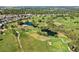 Beautiful aerial view of golf course featuring lush greenery, serene ponds, and scenic walking paths at 5344 E Otero Dr, Centennial, CO 80122