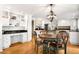 Eat-in kitchen showcases modern lighting, granite countertops, and custom-built cabinetry at 5344 E Otero Dr, Centennial, CO 80122