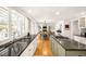 Open kitchen design with granite counters, an eat-in kitchen, and hardwood floors throughout at 5344 E Otero Dr, Centennial, CO 80122