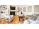 Cozy living room with fireplace, built-in shelving, and comfortable seating at 5344 E Otero Dr, Centennial, CO 80122