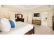 Comfortable main bedroom with neutral colors, ceiling fan, and a view of the en suite bathroom at 5344 E Otero Dr, Centennial, CO 80122
