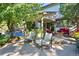Cozy patio with ample seating, a fire pit, and lush landscaping, perfect for entertaining at 5344 E Otero Dr, Centennial, CO 80122