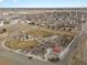 Aerial view of a town with a park and playground at 635 2Nd St, Bennett, CO 80102