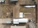 Aerial shot showcasing the property layout, including the house, garage, and surrounding yard at 635 2Nd St, Bennett, CO 80102