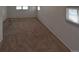 Carpeted bedroom provides a blank canvas for new owners at 635 2Nd St, Bennett, CO 80102