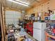 Overstuffed garage with various storage items and tools at 635 2Nd St, Bennett, CO 80102