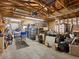 A cluttered garage with various items and tools at 635 2Nd St, Bennett, CO 80102