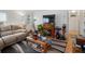 Cozy living room featuring a fireplace, comfortable seating, and natural light, perfect for relaxation at 635 2Nd St, Bennett, CO 80102