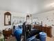 Main bedroom with a queen-size bed and wood furniture at 635 2Nd St, Bennett, CO 80102