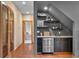Entertaining bar area with shelving, storage and beverage center at 1122 Forest Trails Dr, Castle Pines, CO 80108