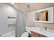 Stylist bathroom with large mirror, modern vanity and walk-in shower with tiled accents at 1122 Forest Trails Dr, Castle Pines, CO 80108