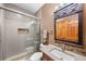 Modern bathroom with glass shower, stylish vanity, and contemporary fixtures at 1122 Forest Trails Dr, Castle Pines, CO 80108