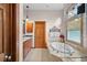Well-appointed bathroom with soaking tub, separate shower, and vanity with storage at 1122 Forest Trails Dr, Castle Pines, CO 80108