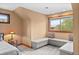 Bright bedroom nook with built-in bench seating and peaceful view at 1122 Forest Trails Dr, Castle Pines, CO 80108