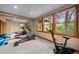 Bright exercise room with gym equipment and large mirror for monitoring your workout form at 1122 Forest Trails Dr, Castle Pines, CO 80108