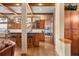 Open concept eat-in kitchen with hardwood floors, wood cabinets, granite countertops, and stainless appliances at 1122 Forest Trails Dr, Castle Pines, CO 80108