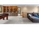 Spacious living room with built-in shelving and a comfortable seating area at 1122 Forest Trails Dr, Castle Pines, CO 80108