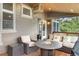 Cozy outdoor seating area with a fire pit, wicker furniture, and patio heater for cooler evenings at 1122 Forest Trails Dr, Castle Pines, CO 80108