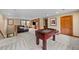 Spacious recreational room with a foosball table, and a large window that provides natural light at 1122 Forest Trails Dr, Castle Pines, CO 80108