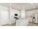 Modern kitchen with white cabinets and granite countertops at 1925 S Coolidge Way, Aurora, CO 80018