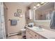 Cozy bathroom featuring a decorative mirror, built-in cabinet and shower with a vintage design at 6857 S Franklin Cir, Centennial, CO 80122