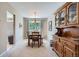 Dining area featuring a wood table, chairs, natural light, and a hutch for storage at 6857 S Franklin Cir, Centennial, CO 80122
