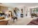 Open-concept living area with a staircase, neutral paint, and a dining area adjacent to the living space at 6857 S Franklin Cir, Centennial, CO 80122