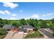 This aerial view highlights the home's landscaping, driveway, and nearby street at 7486 S Washington St, Centennial, CO 80122