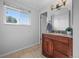 Bathroom vanity features granite countertop, wood cabinets, and modern fixtures at 7486 S Washington St, Centennial, CO 80122