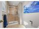 Shower room features a tiled shower with a glass door and modern fixtures at 7486 S Washington St, Centennial, CO 80122