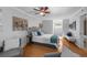 Bright bedroom features a bed, sitting area, and large windows allowing plenty of natural light at 7486 S Washington St, Centennial, CO 80122