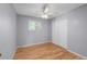 Bedroom with hardwood floors, closet, and natural light from a window at 7486 S Washington St, Centennial, CO 80122