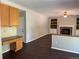 Open-concept living area includes a modern kitchen, living room, and a cozy fireplace at 1251 N Burlington Dr, Castle Rock, CO 80104