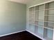 Functional office space offering built-in shelving for storage and organization along with sleek wood floors at 1251 N Burlington Dr, Castle Rock, CO 80104