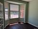 Bright sitting area showcasing a charming bay window with views of the neighborhood and sleek wood floors at 1251 N Burlington Dr, Castle Rock, CO 80104