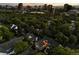 Aerial view of neighborhood with mature trees and city skyline at 4505 S Yosemite St # 362, Denver, CO 80237