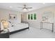 Bright bedroom with a ceiling fan, a black metal bed frame, and a sunny window at 4505 S Yosemite St # 362, Denver, CO 80237