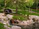 Charming water feature with natural stone, lush landscaping, and tranquil surroundings at 4505 S Yosemite St # 362, Denver, CO 80237