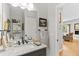 Stylish bathroom with modern sink, vanity, mirror, and updated fixtures at 11826 W Stanford Pl, Morrison, CO 80465