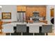 Stylish kitchen featuring granite counters, stainless appliances, and island seating at 11826 W Stanford Pl, Morrison, CO 80465