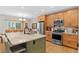 Spacious kitchen featuring stainless steel appliances and kitchen island at 11826 W Stanford Pl, Morrison, CO 80465