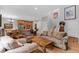 Inviting open-concept living space seamlessly blending the kitchen, dining, and living areas at 11826 W Stanford Pl, Morrison, CO 80465