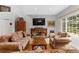 Cozy living room showcasing hardwood floors, comfortable seating, and natural light at 11826 W Stanford Pl, Morrison, CO 80465