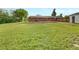 Spacious backyard with a well-maintained lawn and mature trees, ideal for outdoor activities and relaxation at 12682 Anhawa Ave, Longmont, CO 80503