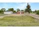 Back of the home showing a detached garage and fenced yard with plenty of space at 12682 Anhawa Ave, Longmont, CO 80503