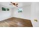 Sunlit bedroom with hardwood floors and a ceiling fan with great natural light at 12682 Anhawa Ave, Longmont, CO 80503