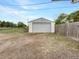 Garage with concrete foundation, roll-up door, and gray painted exterior at 12682 Anhawa Ave, Longmont, CO 80503